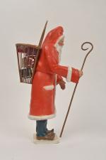 Petitcollin, Père Noël avec sa hotte et sa crosse,
sujet en...