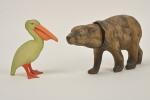 Petitcollin, deux animaux en celluloïd : 
Pélican (H. 11,5 cm)...