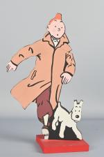 D'après Hergé, Tintin et Milou, figurine 
en bois découpé peint,...