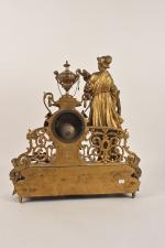 Pendule en bronze doré 
figurant une femme aux épis de...