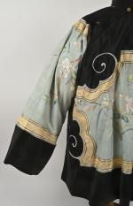 CHINE - Vers 1900
Veste de femme en soie turquoise et...