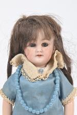 Petite poupée tête porcelaine
Dep Simon & Halbig, moule 749, taille...