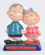 D'après Schulz, Peanuts, figurine en plâtre : "Love is walking...