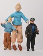 D'après Hergé, Les aventures de Tintin,
trois poupées vêtues dont Tyco...