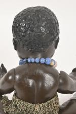 Poupon noir 
Bébé de caractère allemand en céramique, traits peints,...
