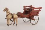 Petite charrette en bois peint rouge
sur deux roues en fer,...