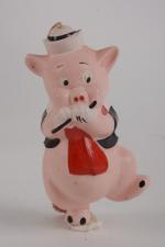 "Nouf-Nouf", petit cochon flûtiste
en celluloïd avec étiquette "Autorisation WDC". 12,5...