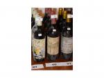 4 bouteilles, Carbonnieux, rouge, 1989, bon niveau, étiquettes sales.