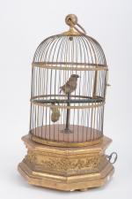 Bontemps, cage à un oiseau chanteur.
Socle octogonal en bois doré....