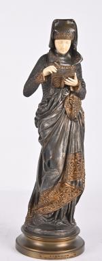 CARRIER-BELLEUSE (1824-1887)
La liseuse épreuve en bronze à patine polychrome doré...