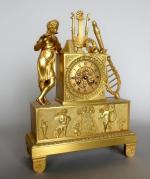 Pendule borne d'époque Empire en bronze doré à décor de...