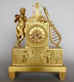Pendule borne d'époque Empire en bronze doré à décor de...