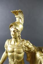 Pendule d'époque Empire en bronze doré à décor d'un guerrier...