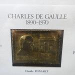 1 cadre tableau doré avec 1 timbre commémoratif du Général...