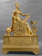 36 - Pendule d'époque Empire en bronze doré à décor...