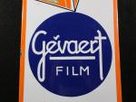 GEVAERT FILM. Plaque publicitaire en tôle émaillée à bords chantournés,...