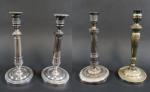 Quatre bougeoirs dont une paire en métal argenté, ép. XIXème...