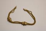Bracelet en or (750 et 585 ) à trois rangs...