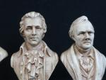 Réunion de trois bustes en plâtre, marqués au dos ECOLE...