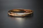 Bracelet formé de trois demi-jonc trois tons d'or 18K (750)...
