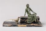 Reveyrollis. " Femme assise au paon ". Groupe en bronze...