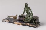 Reveyrollis. " Femme assise au paon ". Groupe en bronze...
