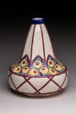 Longwy. Vase piriforme en céramique à émaux polychromes à décor...