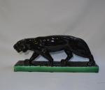 ART DECO
Panthère en céramique émaillée noir, la base émaillée vert
H.:...
