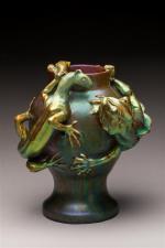 Zsolnay. Vase de forme balustre sur piédouche en céramique irisée...
