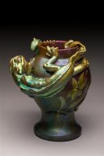 Zsolnay. Vase de forme balustre sur piédouche en céramique irisée...