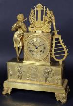 Pendule en bronze doré d'époque Restauration à décor d'un joueur...