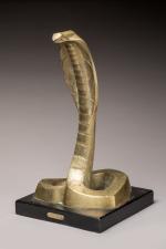 « Naja »
Serpent dressé en bronze doré sur socle en...