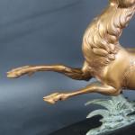 ERGET : Cerf. Bronze à patine bi-colore sur socle ovale...