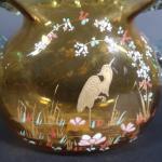 Vase bursiforme en verre teinté ambre et décor émaillé d'un...