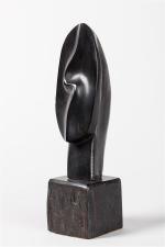 Alexandre Noll (1890-1970)
Sculpture " Tête " en ébène. Signée. H....