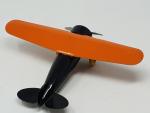 Un avion monoplan en tôle laquée noir/orange, sans marque, envergure...