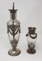 Deux vases en cristal taillé - montures en métal argenté...
