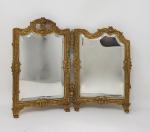 Un miroir de table diptyque en bronze doré - style...