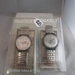 SWATCH 2 montres, bracelet acier Modèle Power steel et Moon...