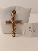 Une croix en or 18 carats Dim : 4x2,2cm Poids...