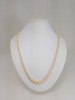 Un collier composé d'un rang de perles de culture en...