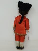 Une poupée garçon en costume de torero, tête de porcelaine,...