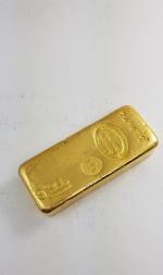 Lingot d'or avec son bulletin d'essai
Compagnie des métaux précieux -...