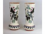 Une paire de vases en faïence - à décor polychrome...