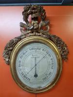 Un baromètre-thermomètre selon RÉAUMUR - cadre en bois sculpté et...