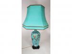 Une lampe en verre opaliné turquoise - à décor polychrome...