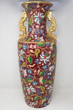 LONGWY - un vase émaillé à décor floral sur fond...