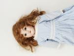 Une poupée à tête-buste de porcelaine,  « Made in...