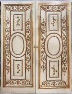 *Une paire de portes en bois peint sculpté et doré...