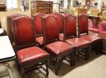 * Une suite de huit chaises en cuir rouge, piètement...